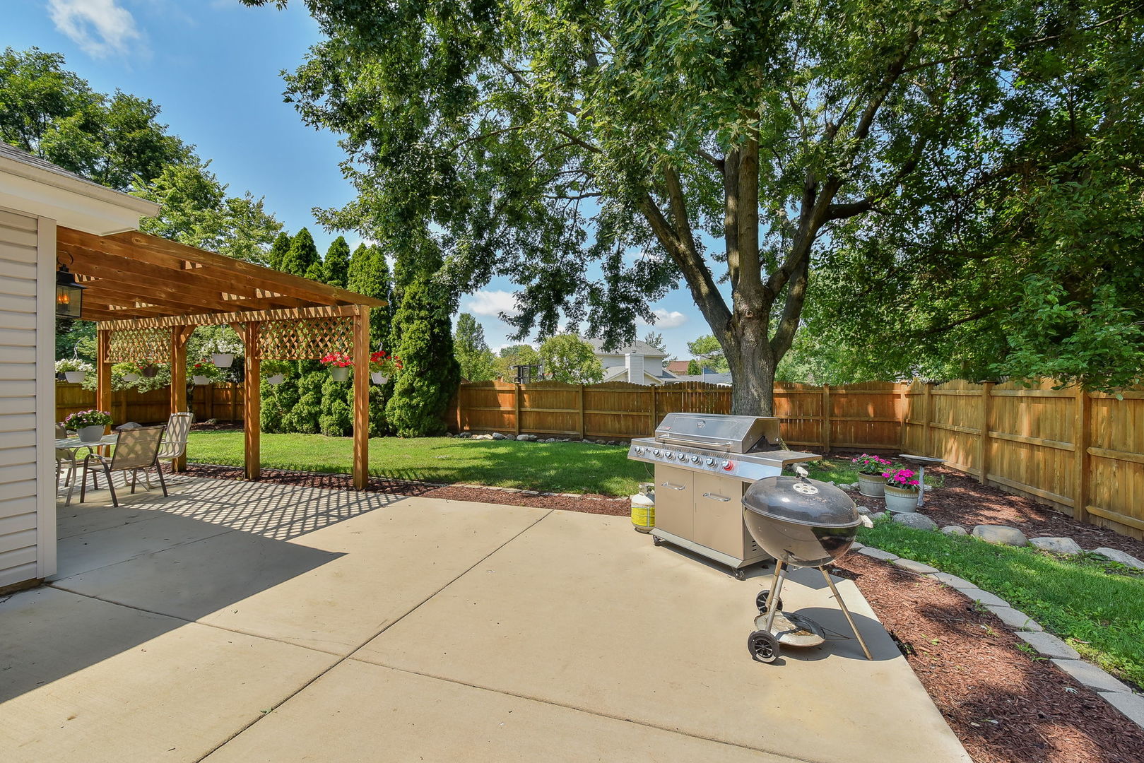 3136 Quincy Lane Aurora, IL 60504 - Photo 21 of 23 a view of a backyard with sitting area