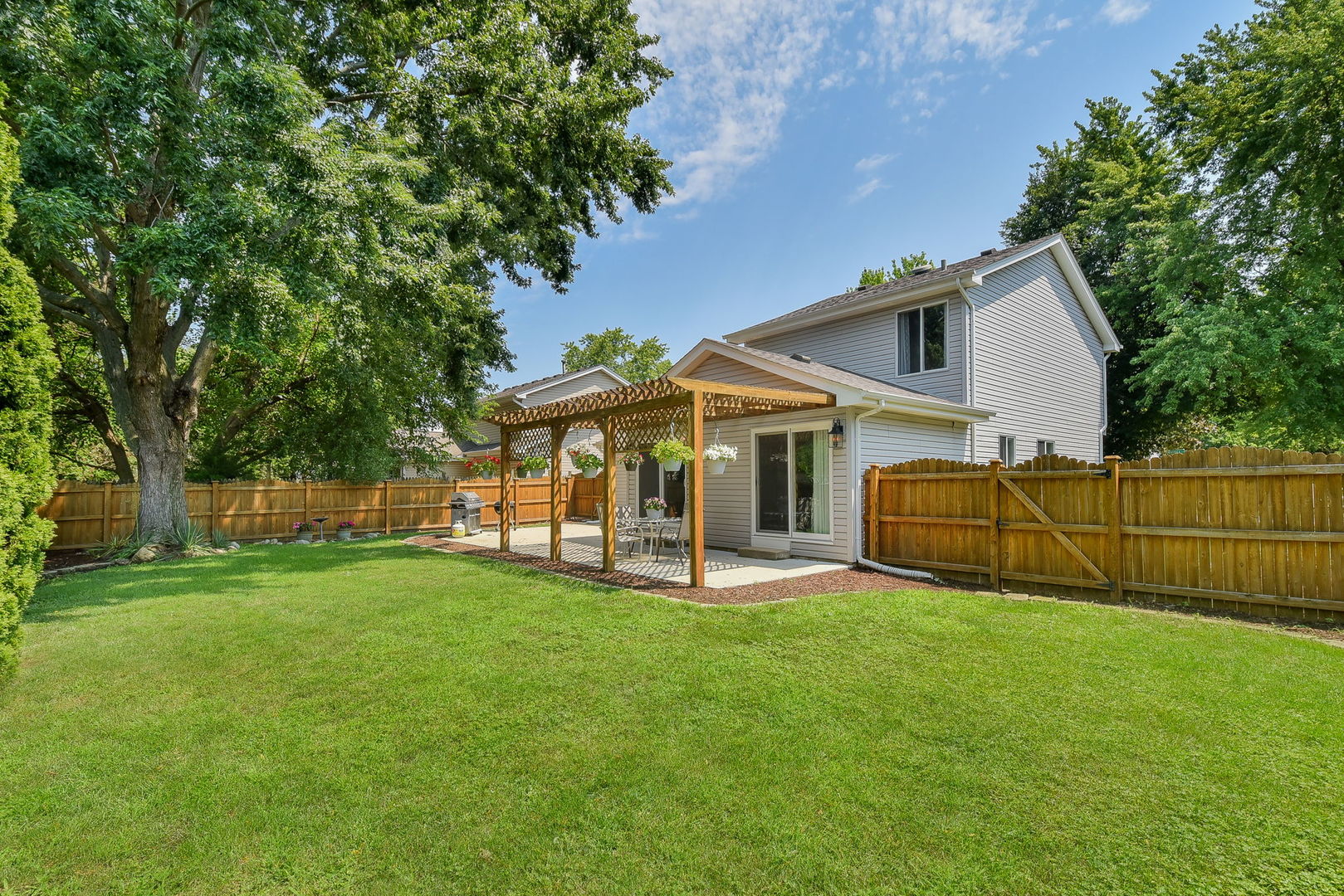 3136 Quincy Lane Aurora, IL 60504 - Photo 23 of 23 a view of a house with a yard and sitting area