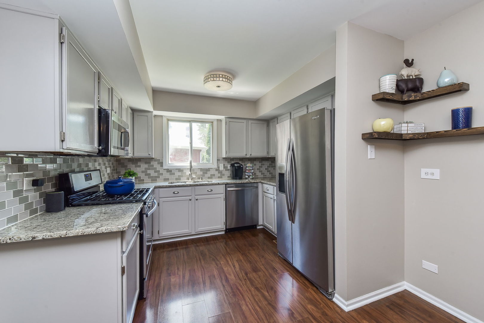 3136 Quincy Lane Aurora, IL 60504 - Photo 6 of 23 a kitchen with granite countertop a refrigerator stove top oven and sink