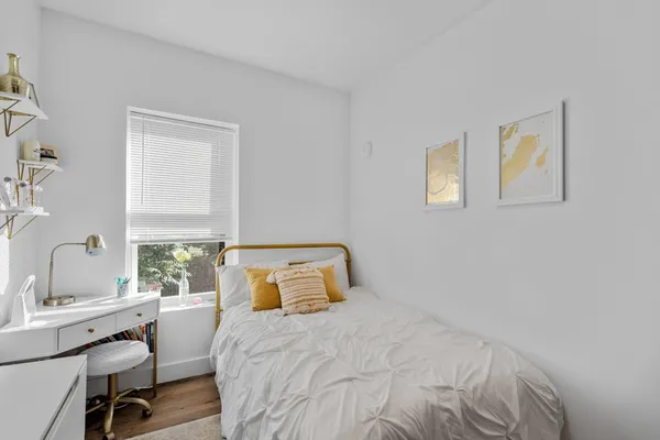 a bedroom with a bed and a table