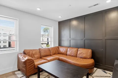 a living room with a couch and a window