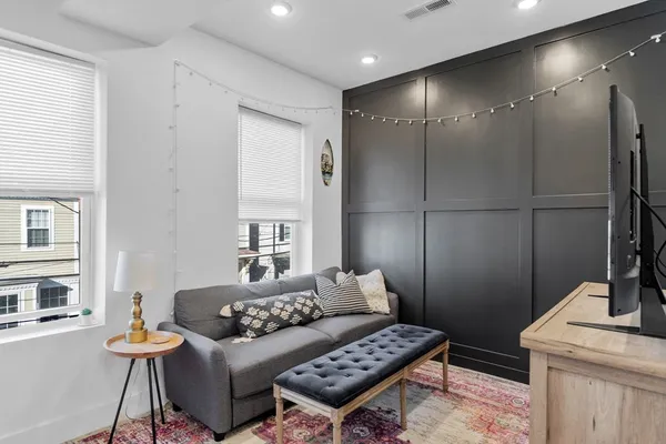 a living room with furniture and a table