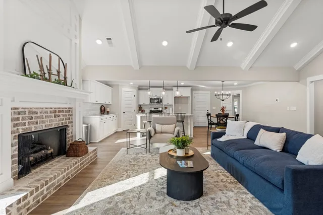 a living room with furniture and a fireplace