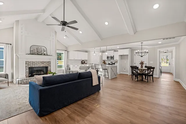 a living room with furniture and a fireplace