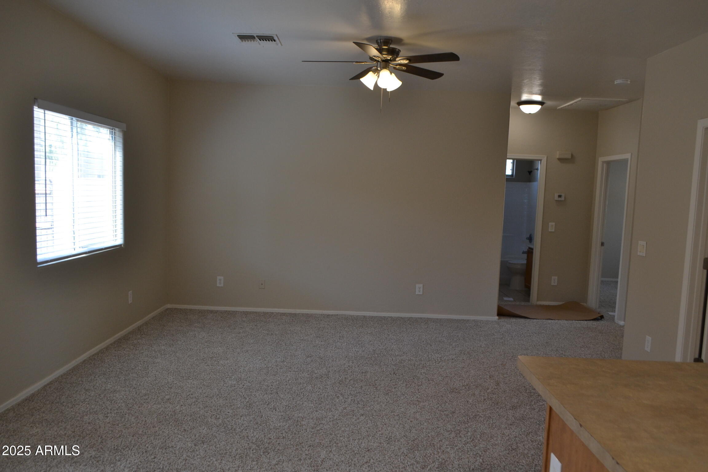 2300 East Magma Road, Unit 77 San Tan Valley, AZ 85143 - Photo 4 of 12 an empty room with windows and closet