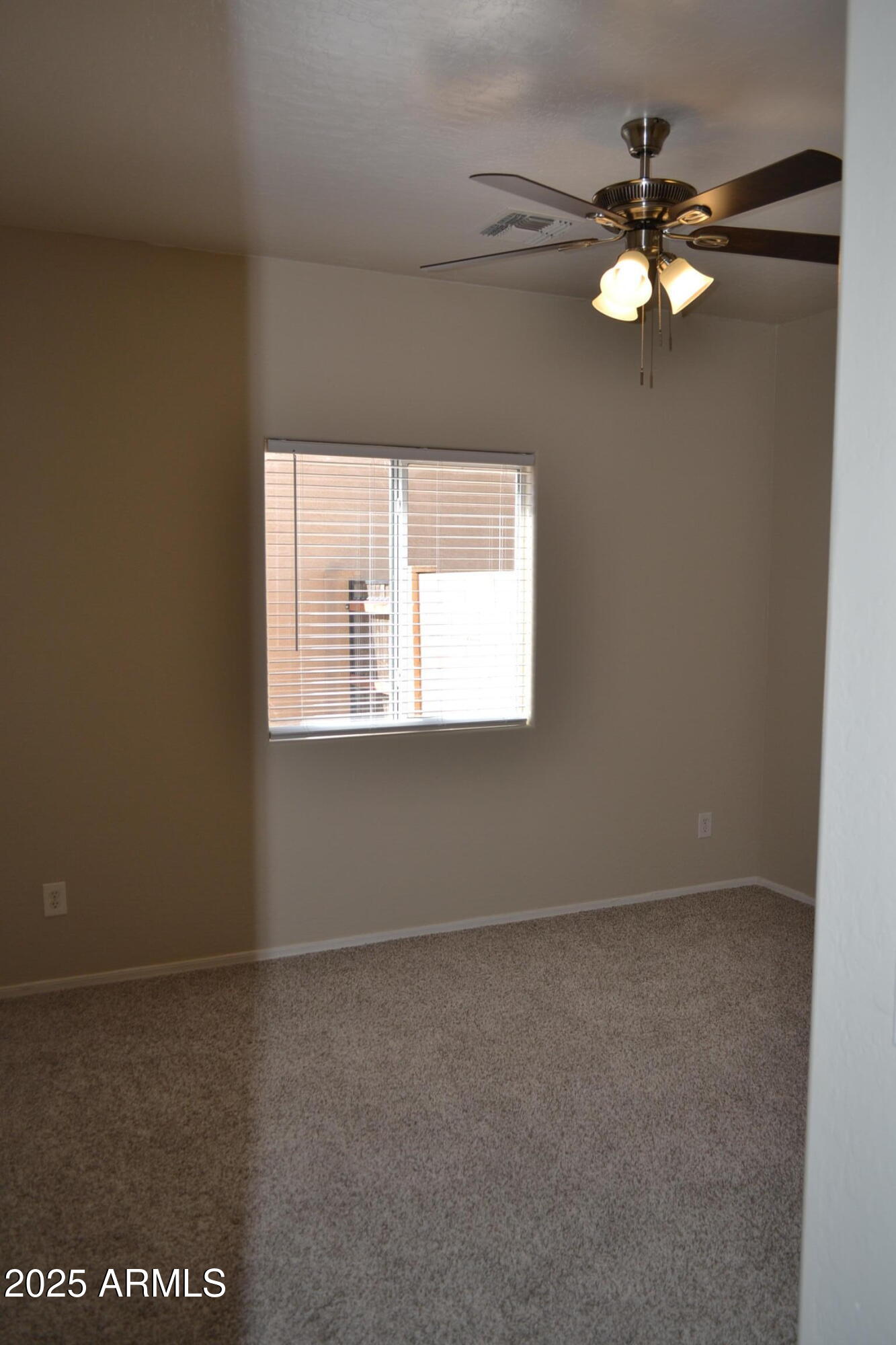 2300 East Magma Road, Unit 77 San Tan Valley, AZ 85143 - Photo 8 of 12 an empty room with a window