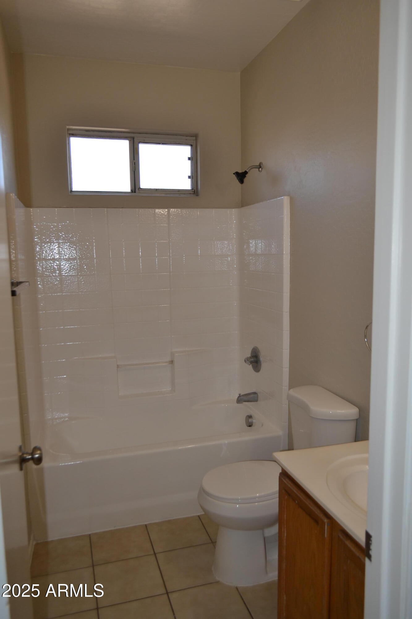 2300 East Magma Road, Unit 77 San Tan Valley, AZ 85143 - Photo 9 of 12 a bathroom with a shower a toilet and a sink