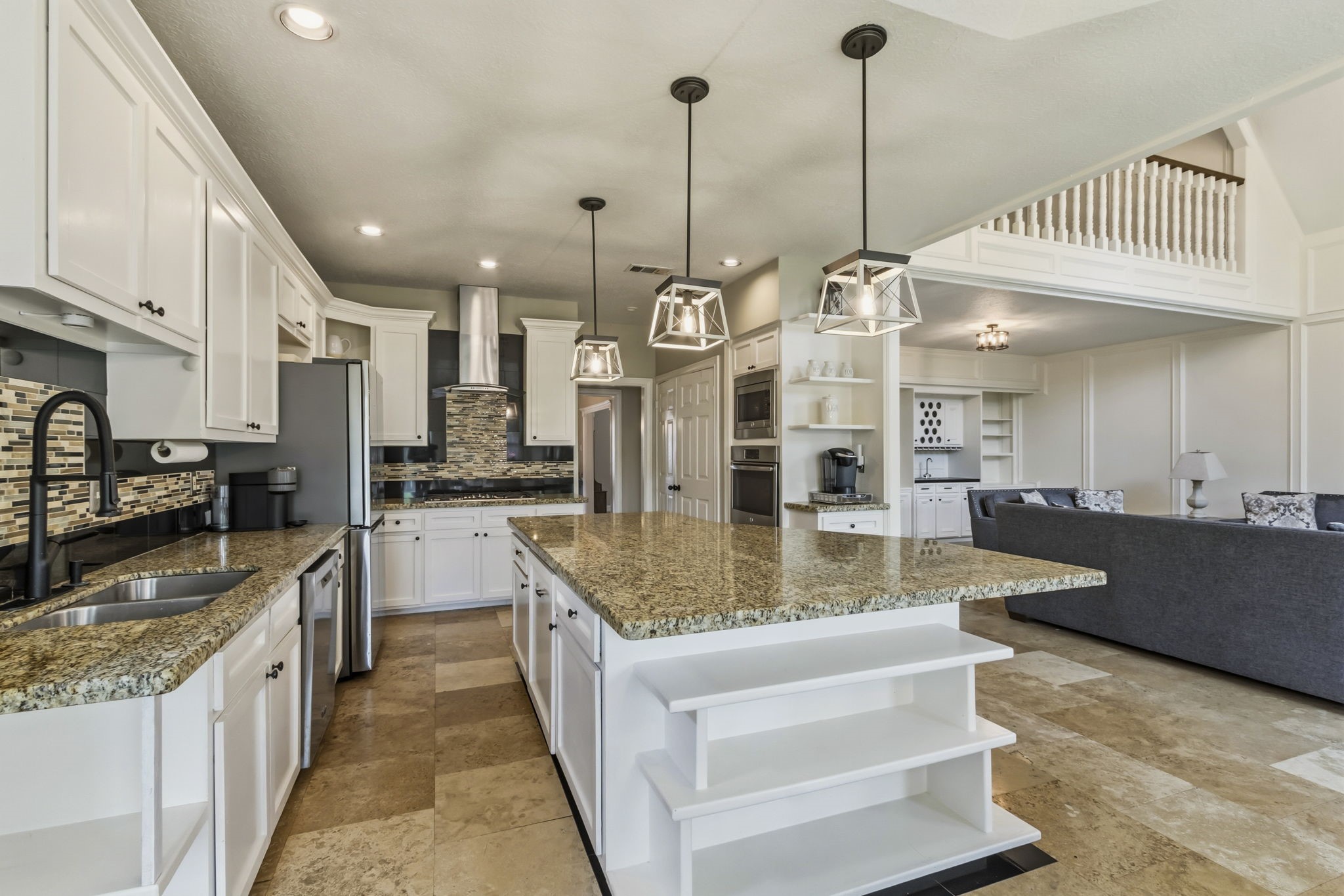 17618 Hidden Forest Drive Spring, TX 77379 - Photo 16 of 49 a large kitchen with kitchen island a large counter top stainless steel appliances and cabinets