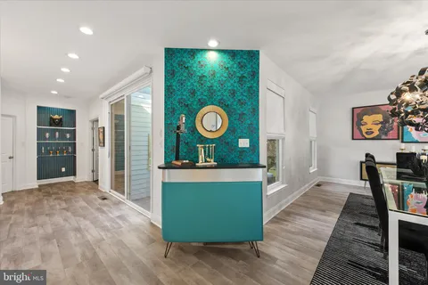 a view of kitchen with furniture and wooden floor