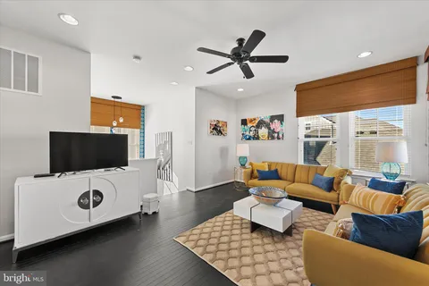 a living room with furniture and a rug