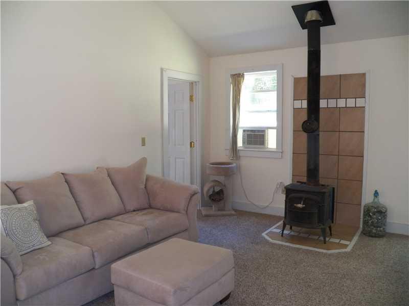 9 Partridge Road Searsport, ME 04974 - Photo 7 of 11 Living Room. Wood stove in living room.
