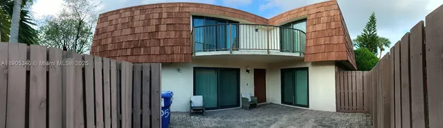 a front view of a house with a garage