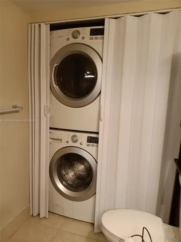 a view of a hallway with washer and dryer