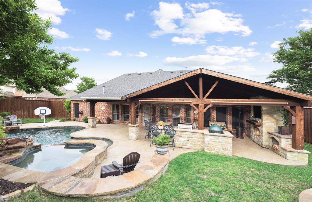 a view of a house with pool and chairs