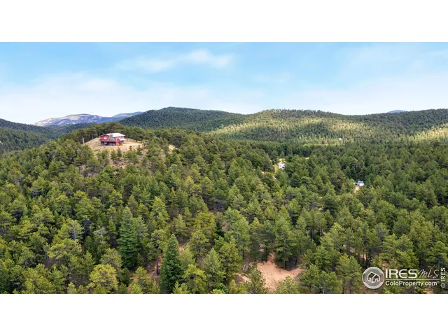 a open area with mountains in the background