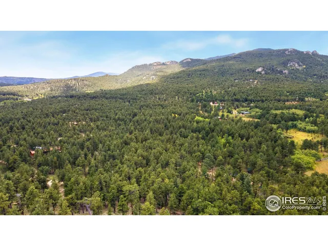 a open area with mountains in the background