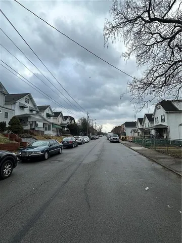 a view of parking space with parked cars