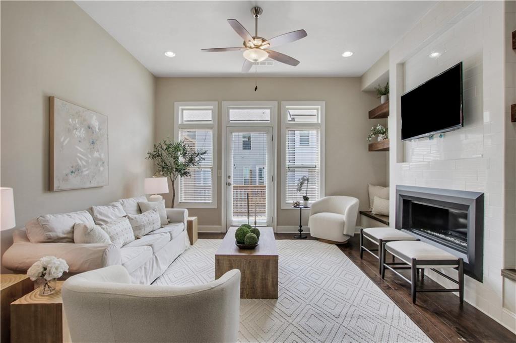 4103 Township Parkway Atlanta, GA 30342 - Photo 1 of 42 a living room with furniture fireplace and flat screen tv
