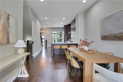 a view of a dining room with furniture and wooden floor