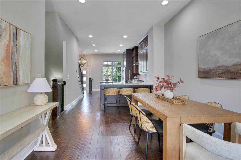 4103 Township Parkway Atlanta, GA 30342 - Photo 12 of 42 a view of a dining room with furniture and wooden floor