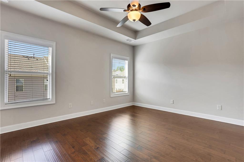 4103 Township Parkway Atlanta, GA 30342 - Photo 16 of 42 a view of an empty room with wooden floor and a window