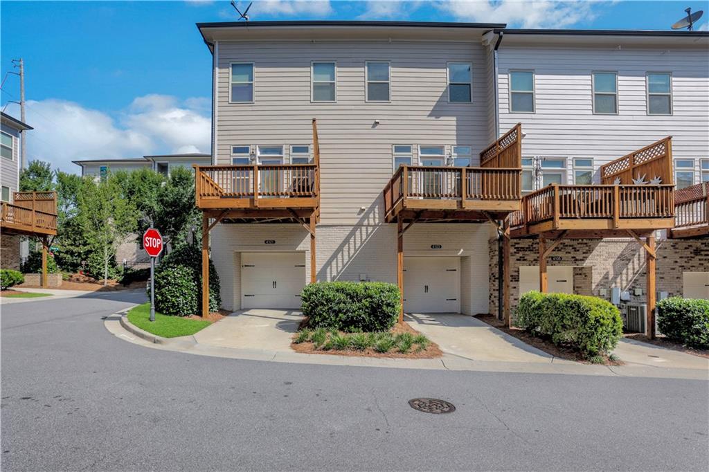 4103 Township Parkway Atlanta, GA 30342 - Photo 26 of 42 a view of a house with a small yard and plants