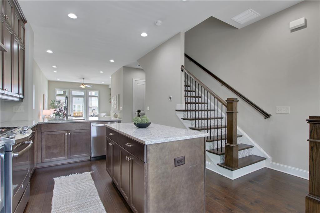4103 Township Parkway Atlanta, GA 30342 - Photo 6 of 42 a kitchen with sink cabinets and entryway