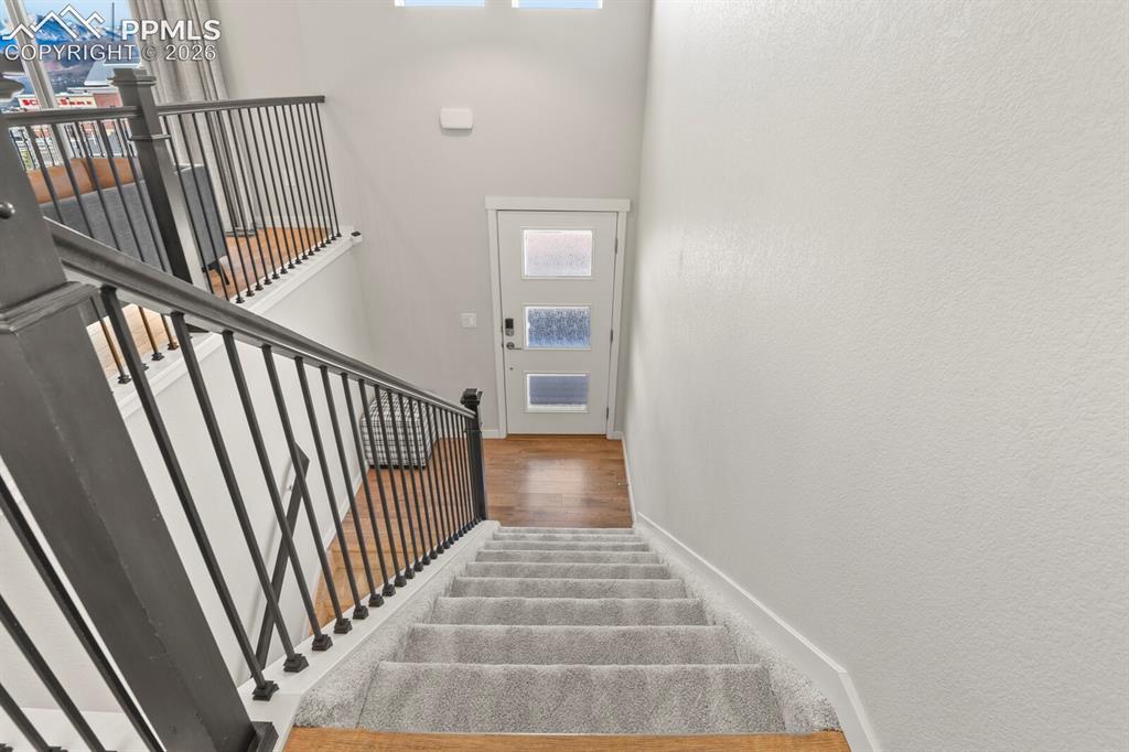 11314 Modern Meadow Loop Colorado Springs, CO 80921 - Photo 5 of 30 a view of a hallway view with staircase