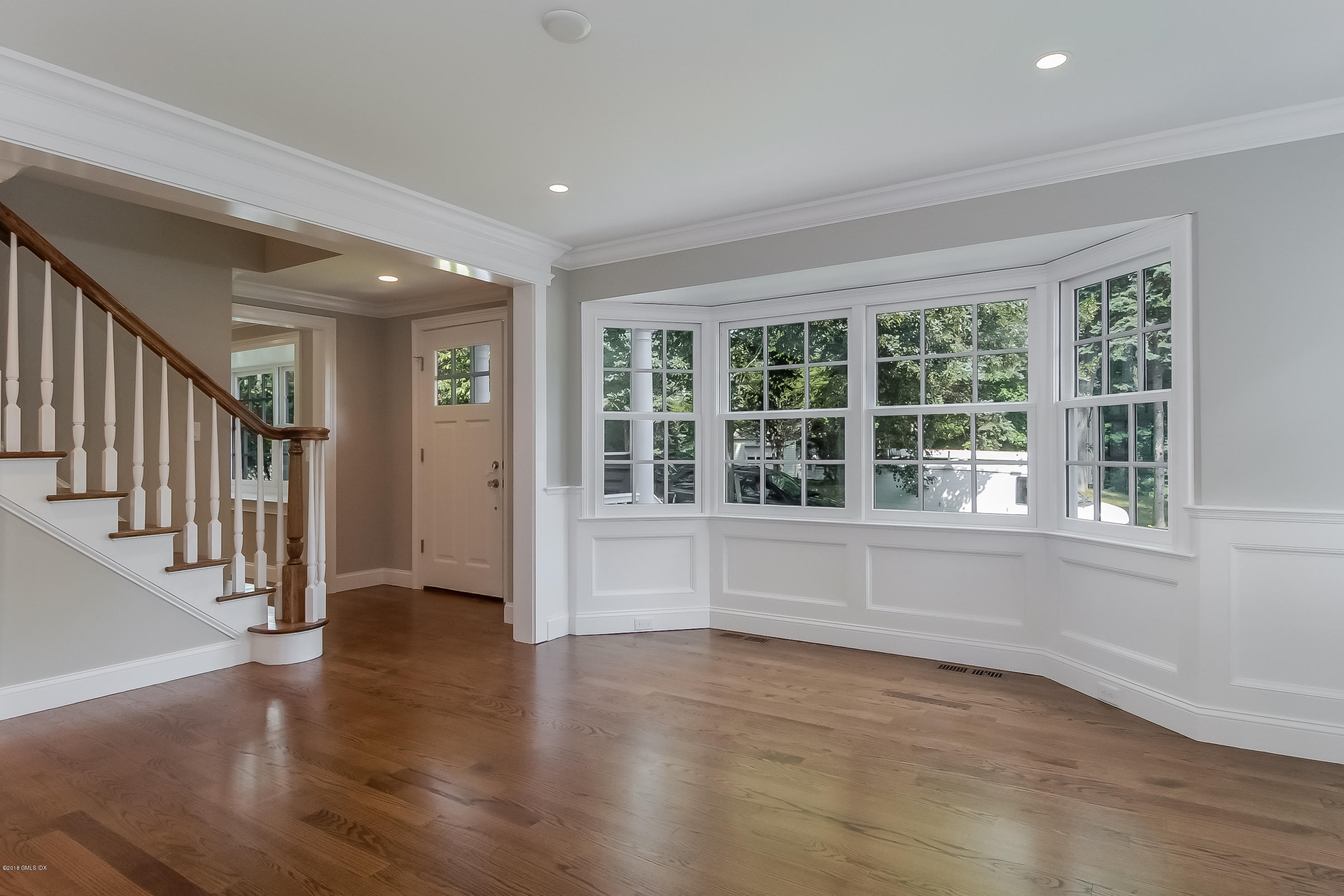 6 Dialstone Lane Riverside, CT 06878 - Photo 3 of 24 a view of an entryway with wooden floor and windows