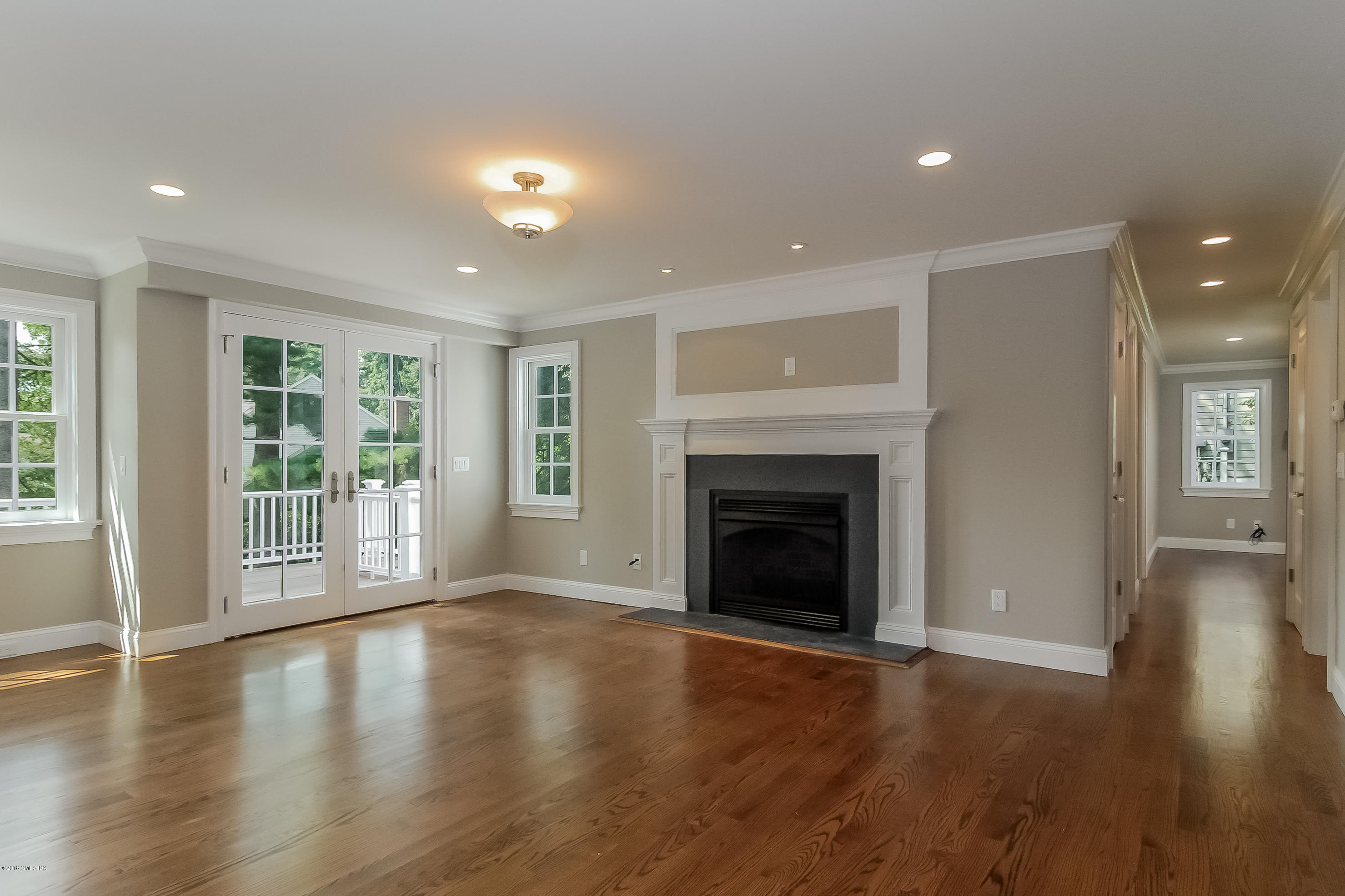 6 Dialstone Lane Riverside, CT 06878 - Photo 5 of 24 a view of an empty room with wooden floor and a window