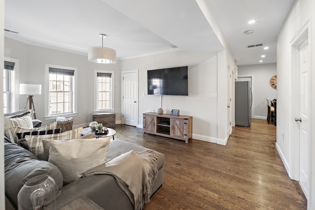 38 Pearl Street, Unit 2 Everett, MA 02149 - Photo 1 of 26 a living room with furniture and a flat screen tv