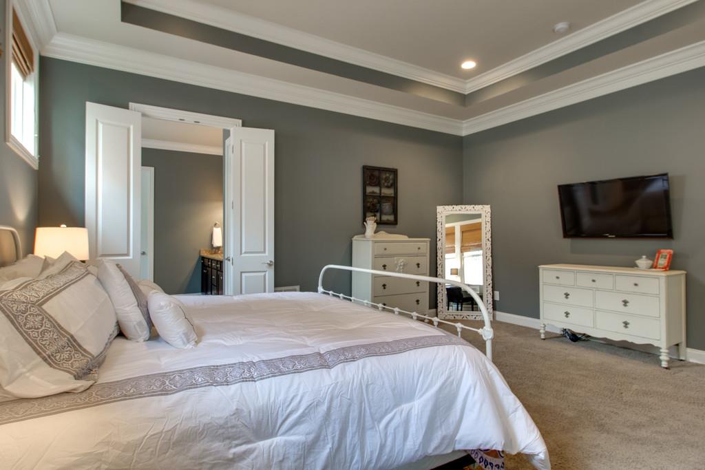 1409 Eliot Road Franklin, TN 37064 - Photo 11 of 27 a bedroom with furniture and flat screen tv