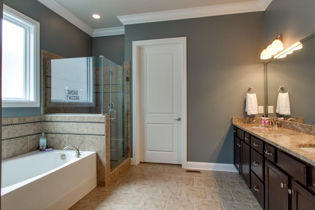 1409 Eliot Road Franklin, TN 37064 - Photo 12 of 27 a bathroom with a double vanity sink mirror and bathtub