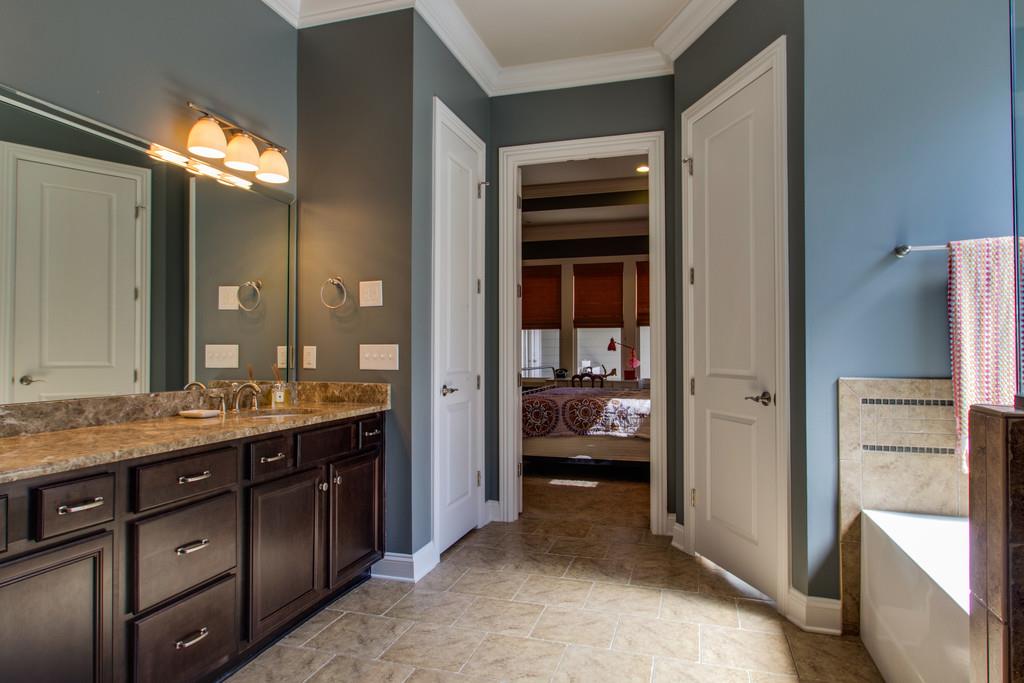 1409 Eliot Road Franklin, TN 37064 - Photo 13 of 27 a en suite bathroom with a double vanity sink and a mirror