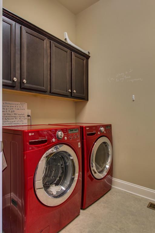 1409 Eliot Road Franklin, TN 37064 - Photo 14 of 27 a utility room with sink dryer and washer