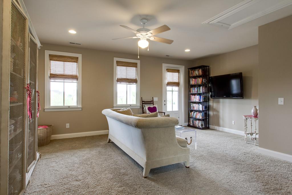 1409 Eliot Road Franklin, TN 37064 - Photo 19 of 27 a living room with furniture and a flat screen tv