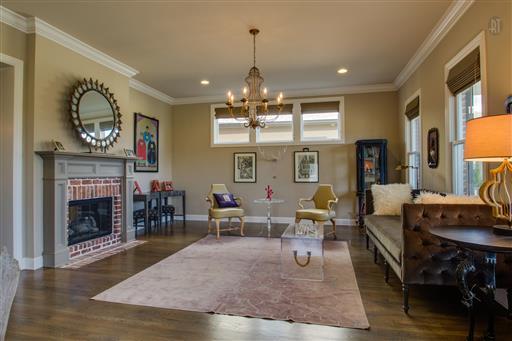 1409 Eliot Road Franklin, TN 37064 - Photo 2 of 27 a living room with furniture dining table and a fireplace