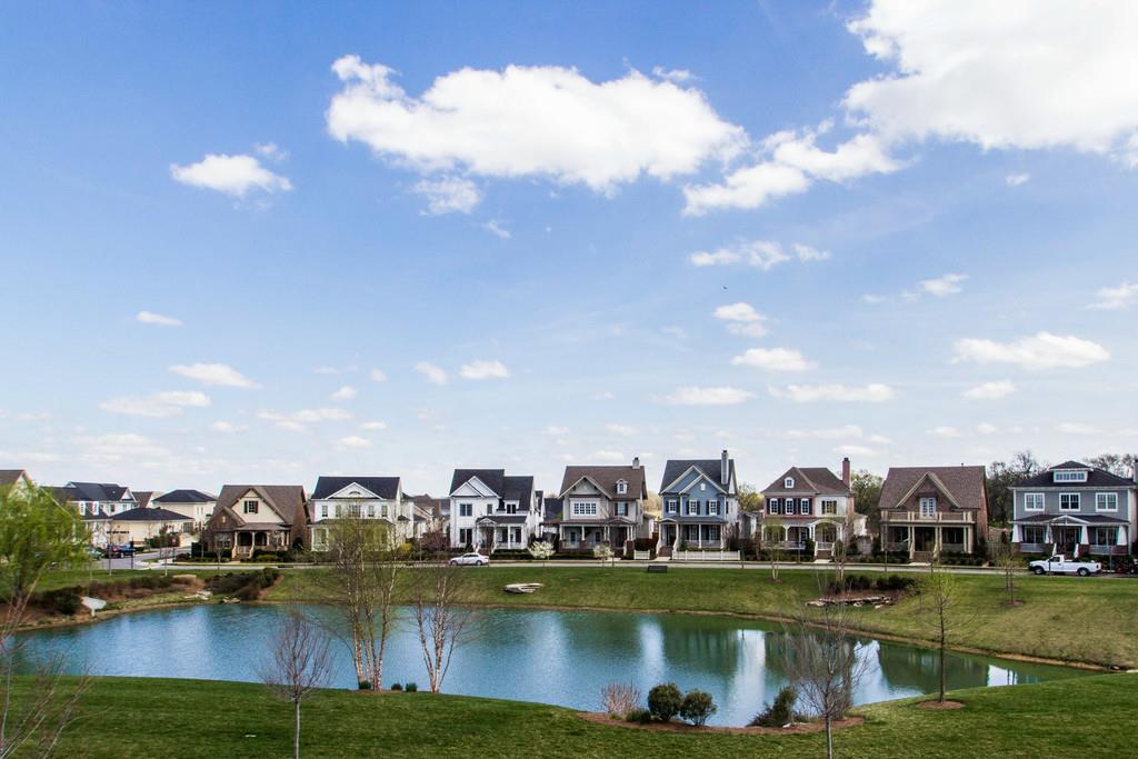 1409 Eliot Road Franklin, TN 37064 - Photo 21 of 27 a view of a lake with houses in the back