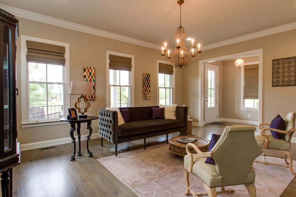 1409 Eliot Road Franklin, TN 37064 - Photo 3 of 27 a living room with furniture and a chandelier