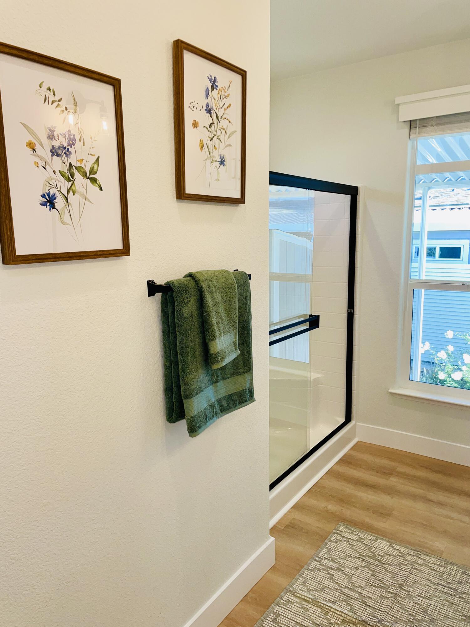 340 Old Mill Road, Unit SPC 214 Santa Barbara, CA 93110 - Photo 11 of 31 a view of a hallway with wooden floor and a refrigerator