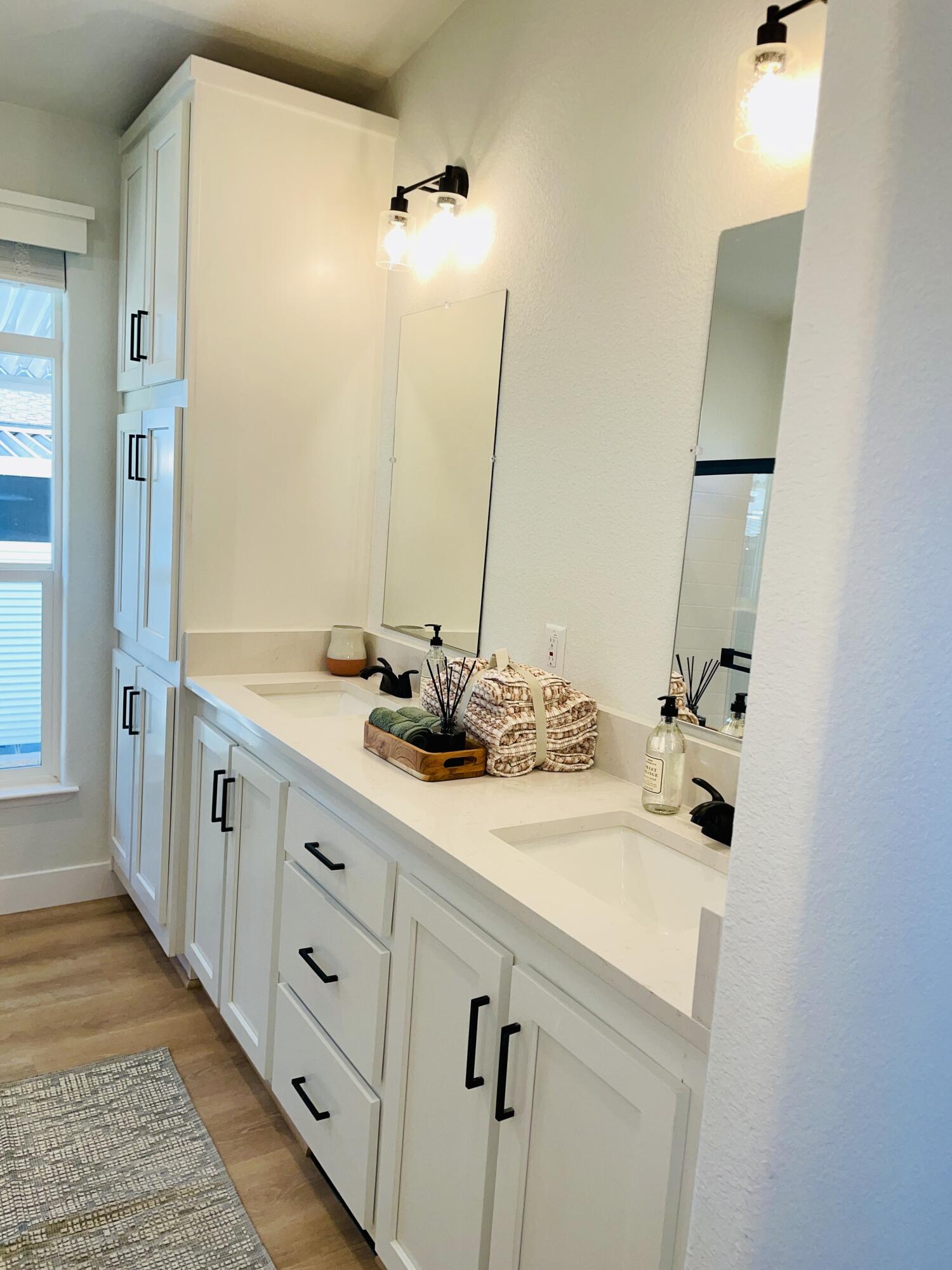 340 Old Mill Road, Unit SPC 214 Santa Barbara, CA 93110 - Photo 12 of 31 a bathroom with a double vanity sink and mirror
