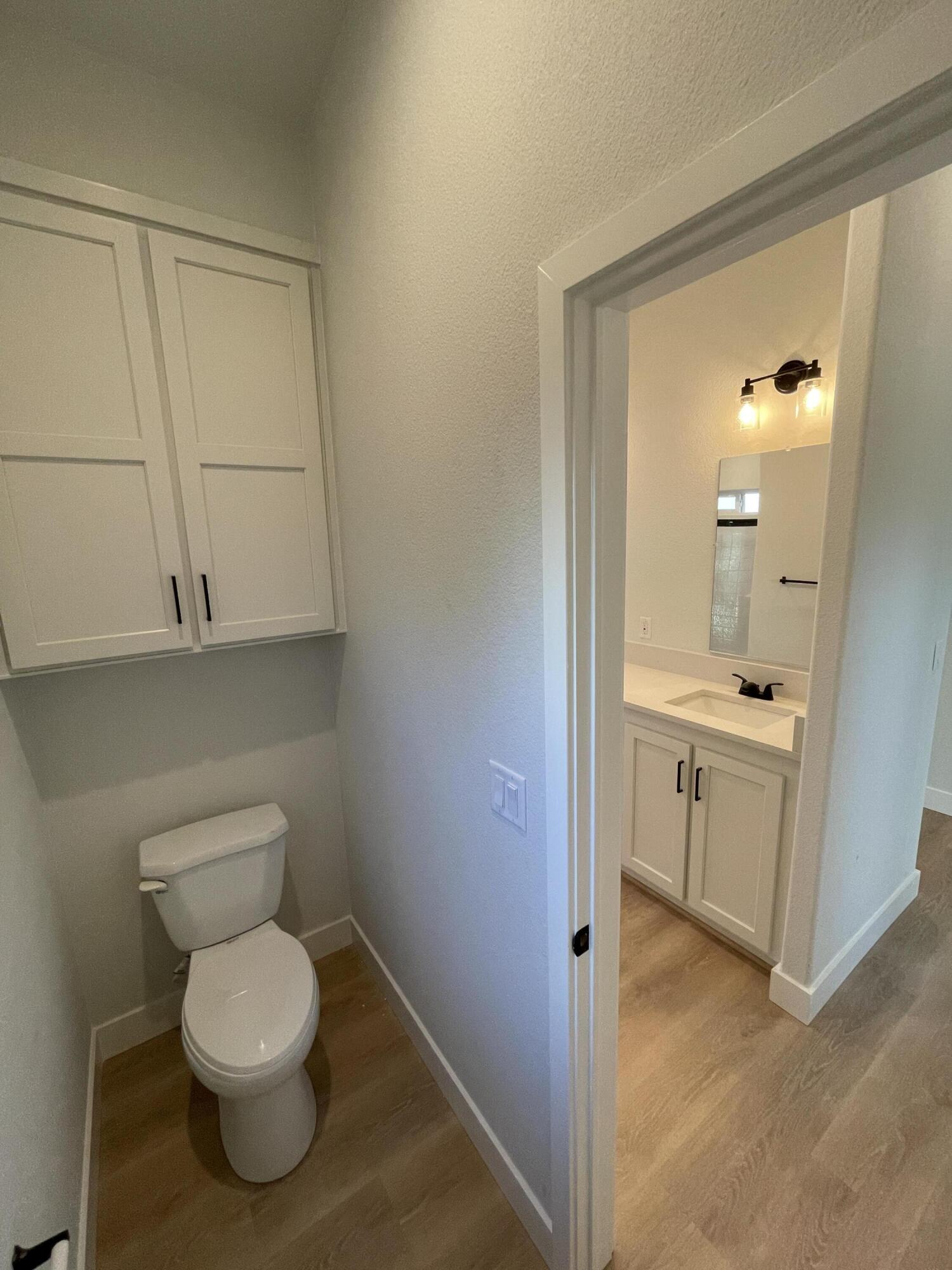 340 Old Mill Road, Unit SPC 214 Santa Barbara, CA 93110 - Photo 13 of 31 a bathroom with a toilet a sink and mirror