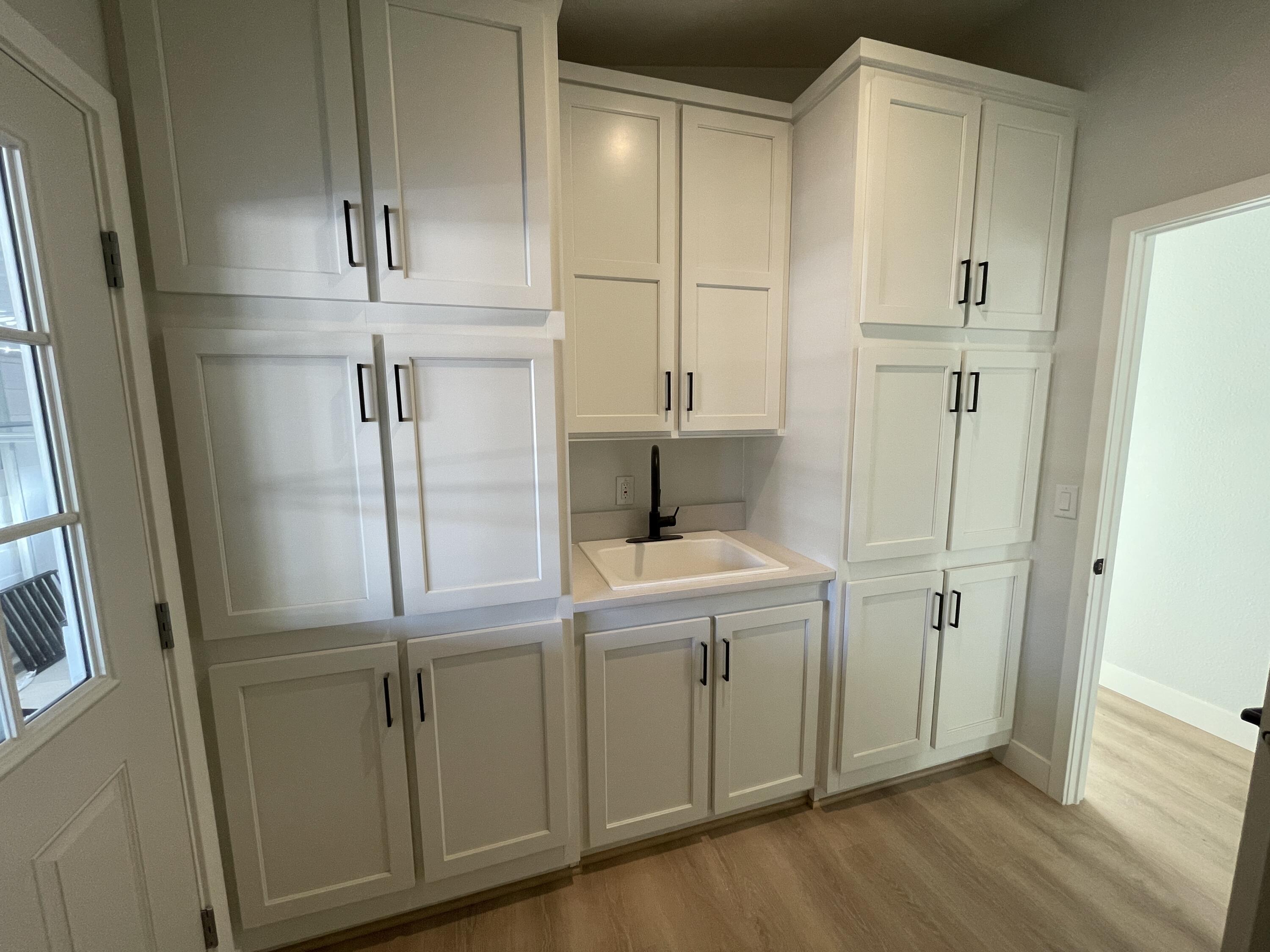 340 Old Mill Road, Unit SPC 214 Santa Barbara, CA 93110 - Photo 18 of 31 a room with cabinets and wooden floor