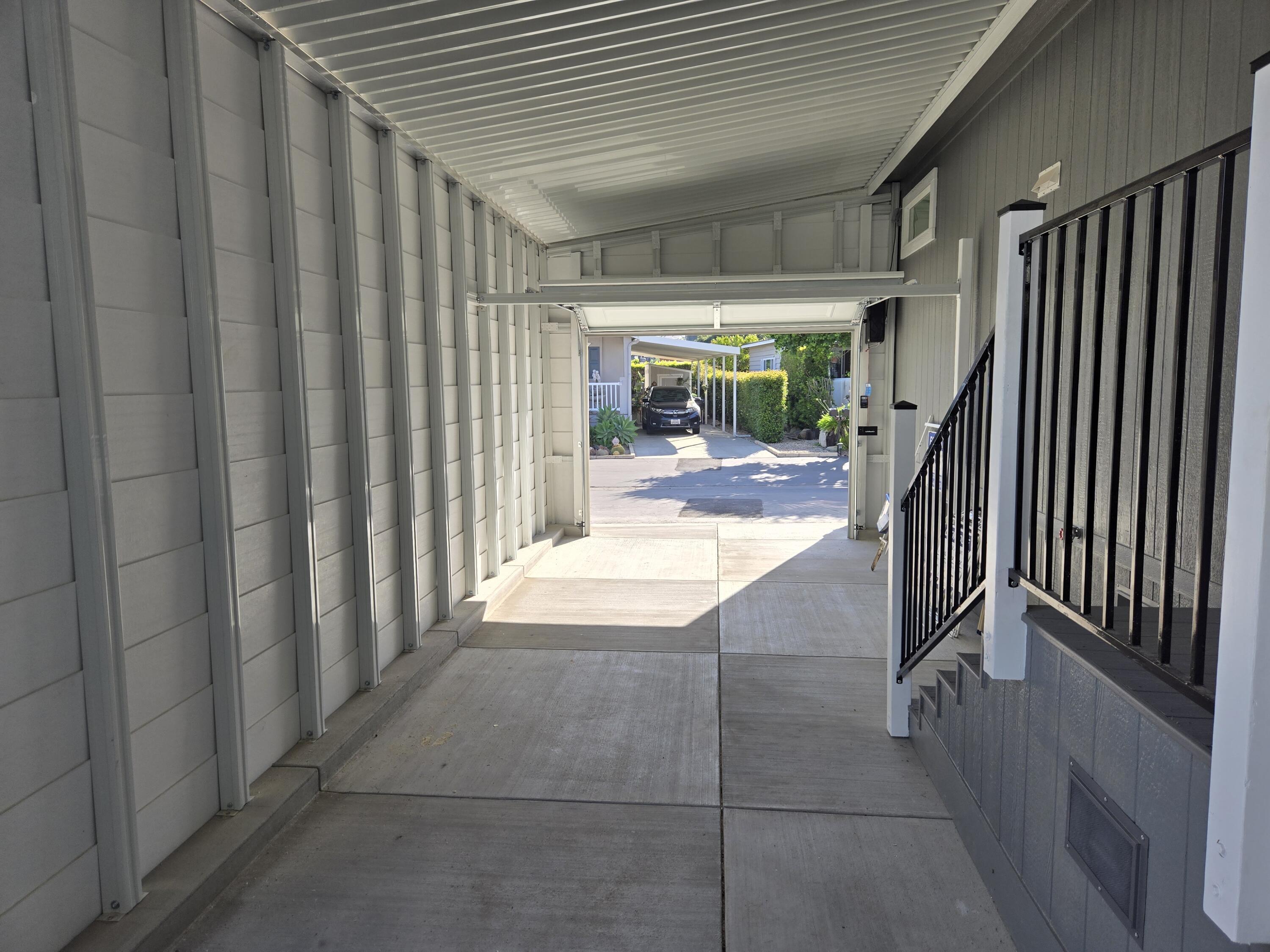 340 Old Mill Road, Unit SPC 214 Santa Barbara, CA 93110 - Photo 25 of 31 a view of a hallway with wooden floor and staircase