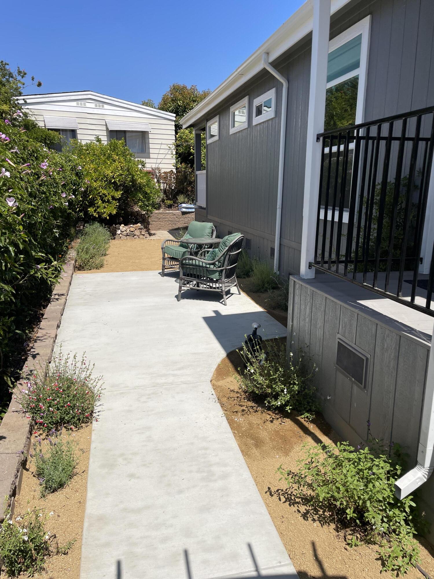 340 Old Mill Road, Unit SPC 214 Santa Barbara, CA 93110 - Photo 6 of 31 a view of a backyard with sitting area