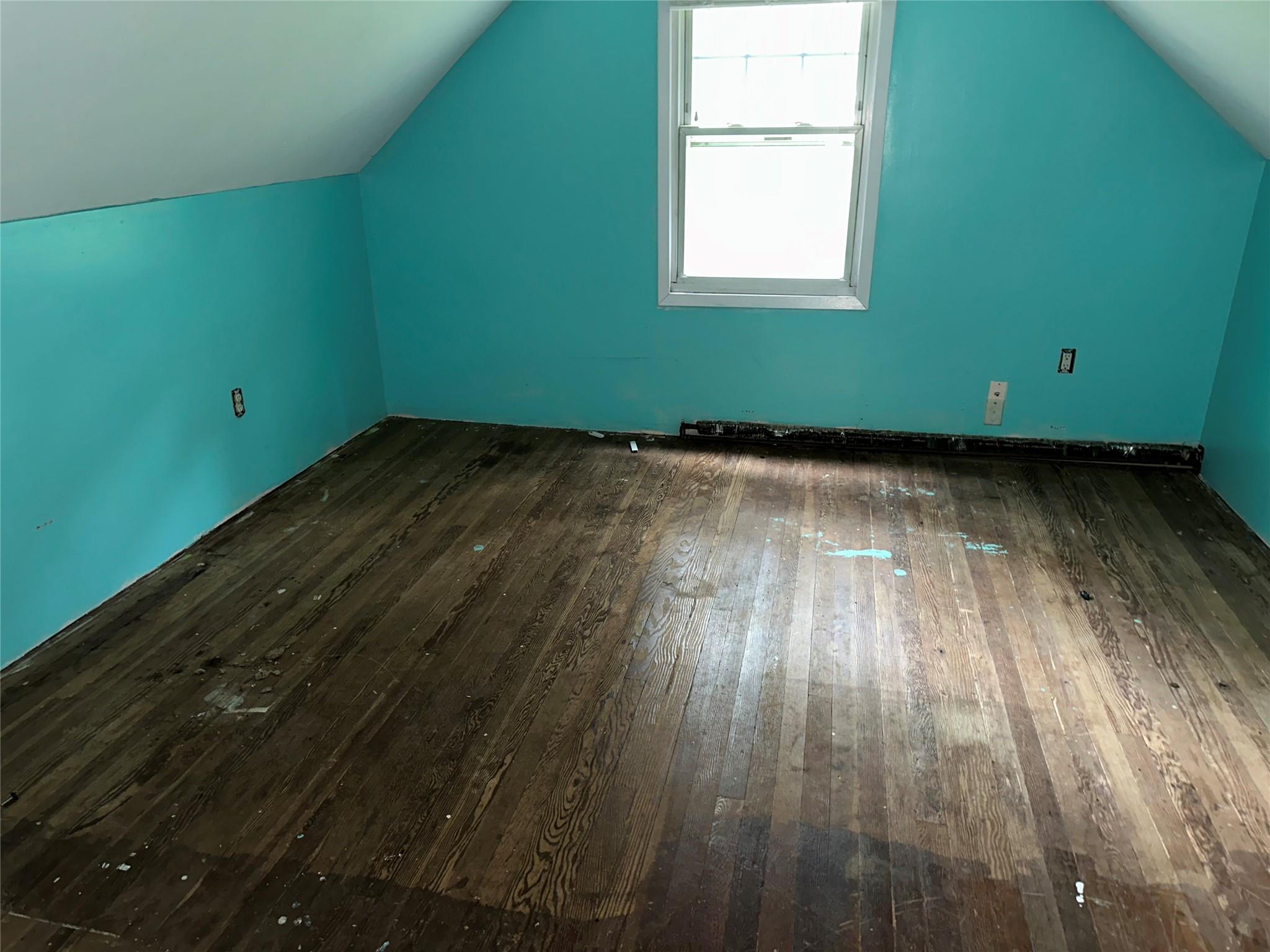 77 Lincoln Road Medford, NY 11763 - Photo 9 of 14 a view of a room with wooden floor and a window