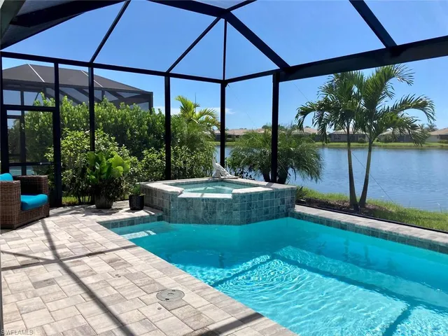 a view of a swimming pool with a patio