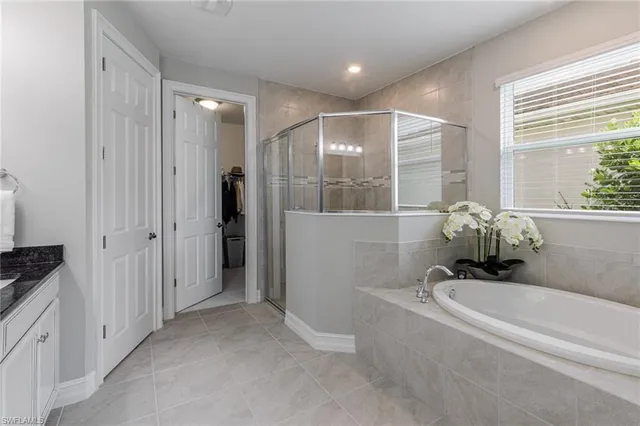 a large white kitchen with a sink