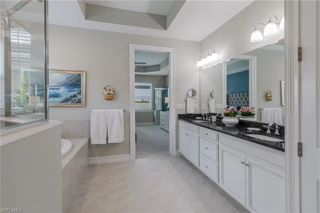 a living room with furniture and a view of kitchen