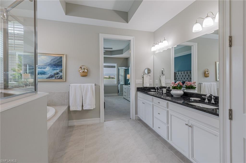 14614 Stillwater Way Naples, FL 34114 - Photo 21 of 47 a large white kitchen with a sink